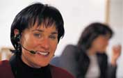 Photo of woman with headset.